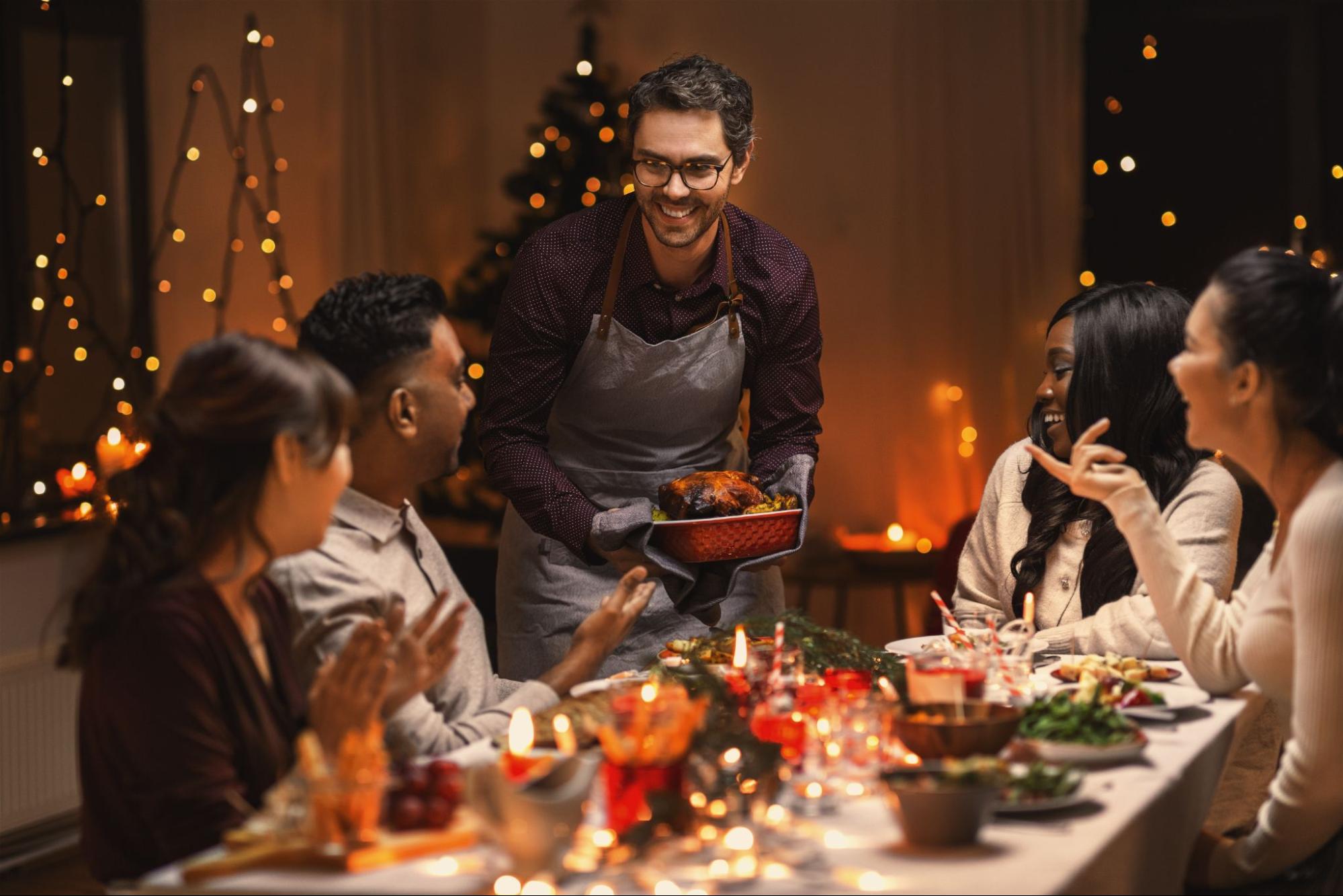 Group of Friends eating around the table ©Ground Picture