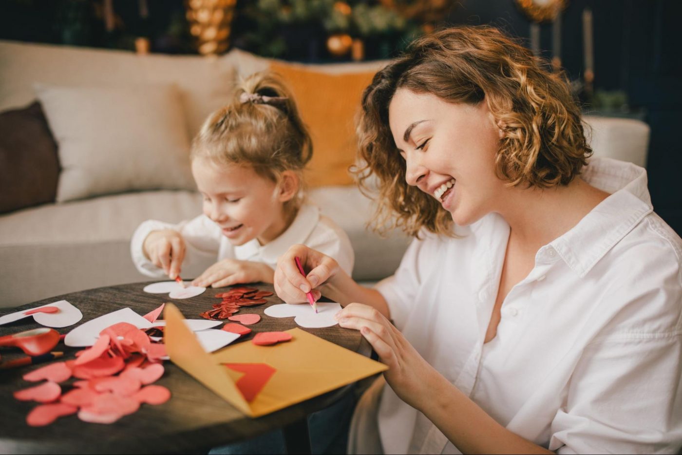 mom and daughter making valentines crafts © polinaloves